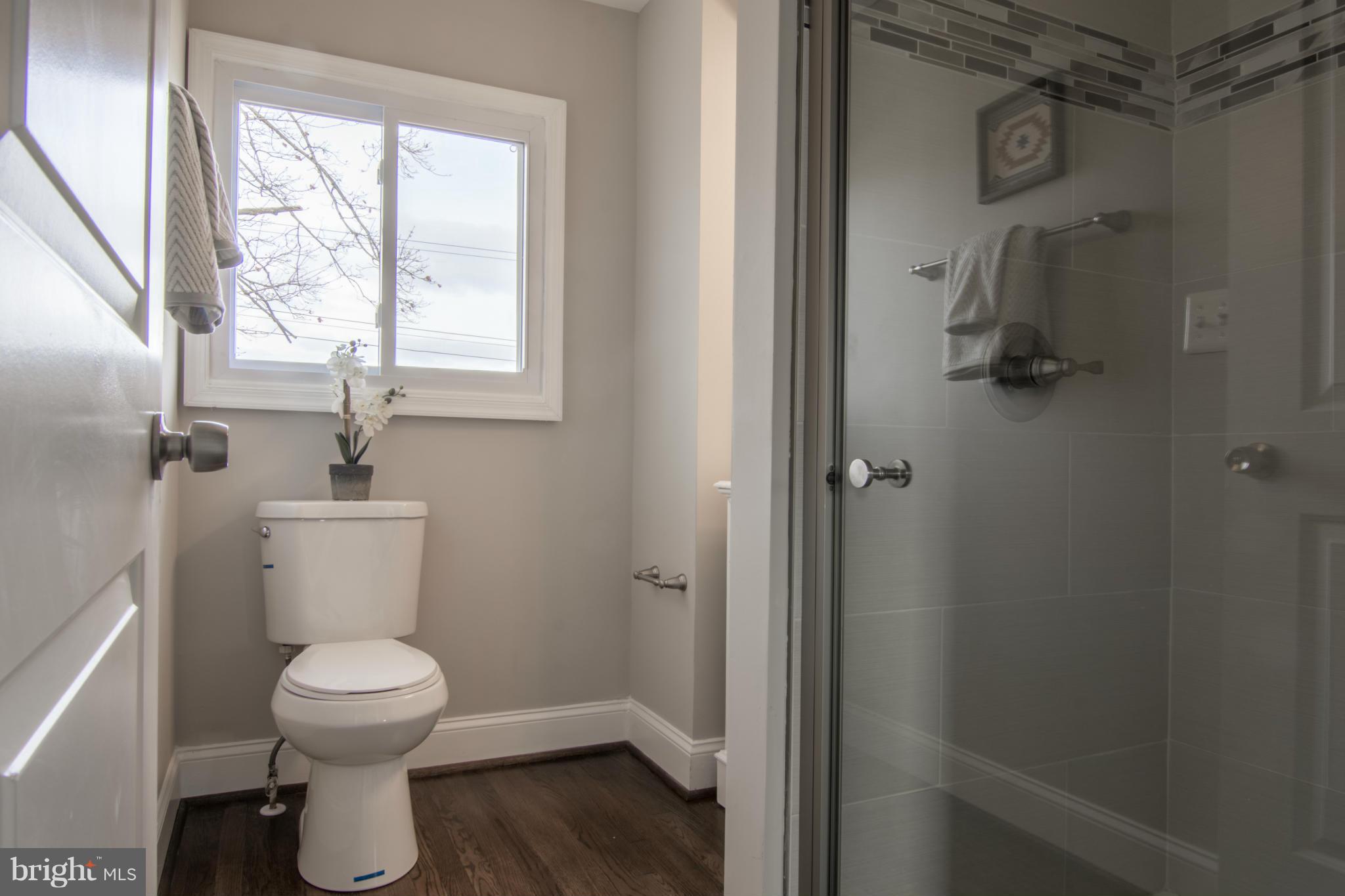 922 Bardswell Road Catonsville, MD 21228 - Photo 22 of 30 a bathroom with a toilet sink and window