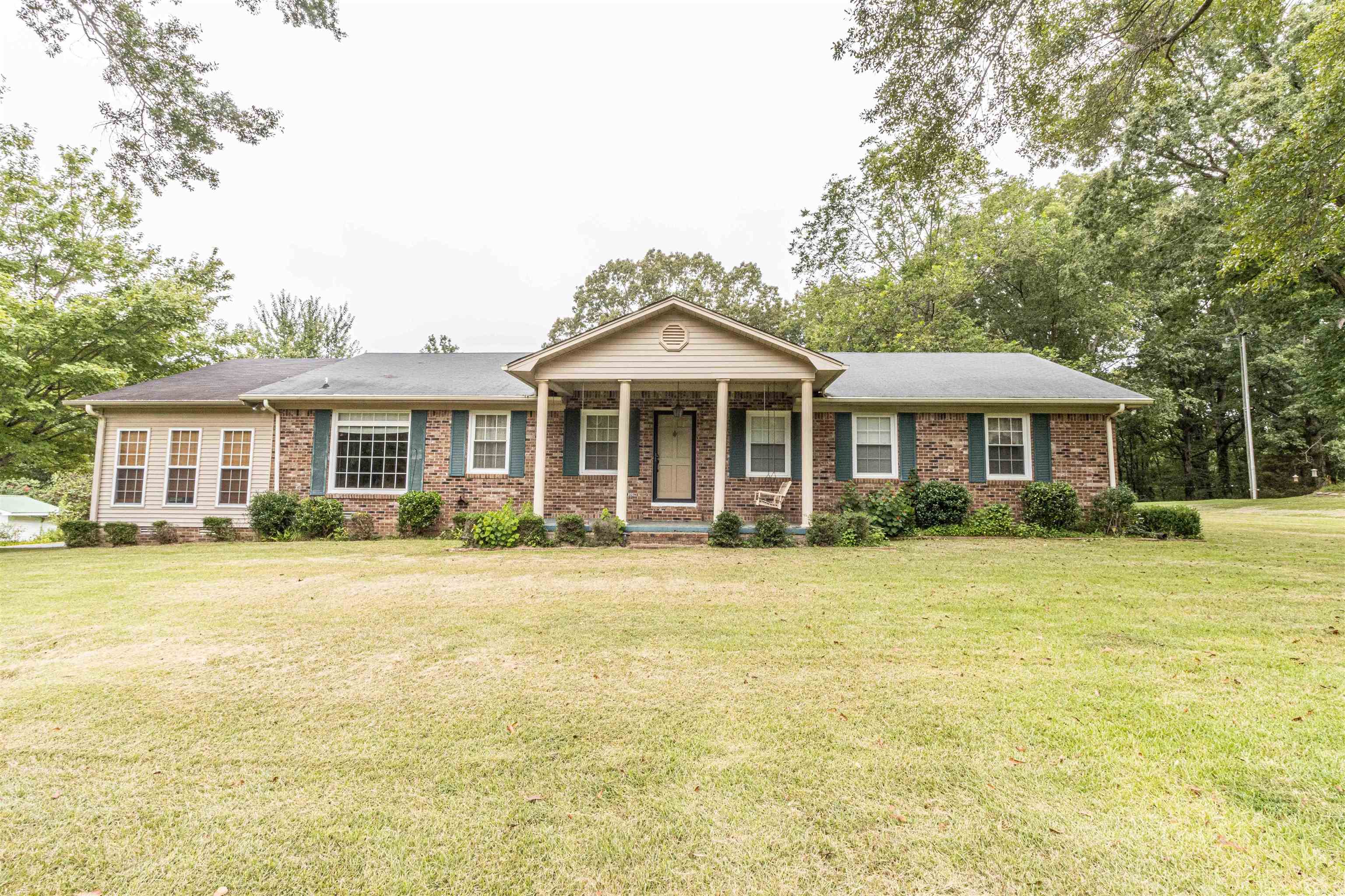 239 Old Road South, Unit 5 Selmer, TN 38375 - Photo 2 of 34 a front view of a house with a yard