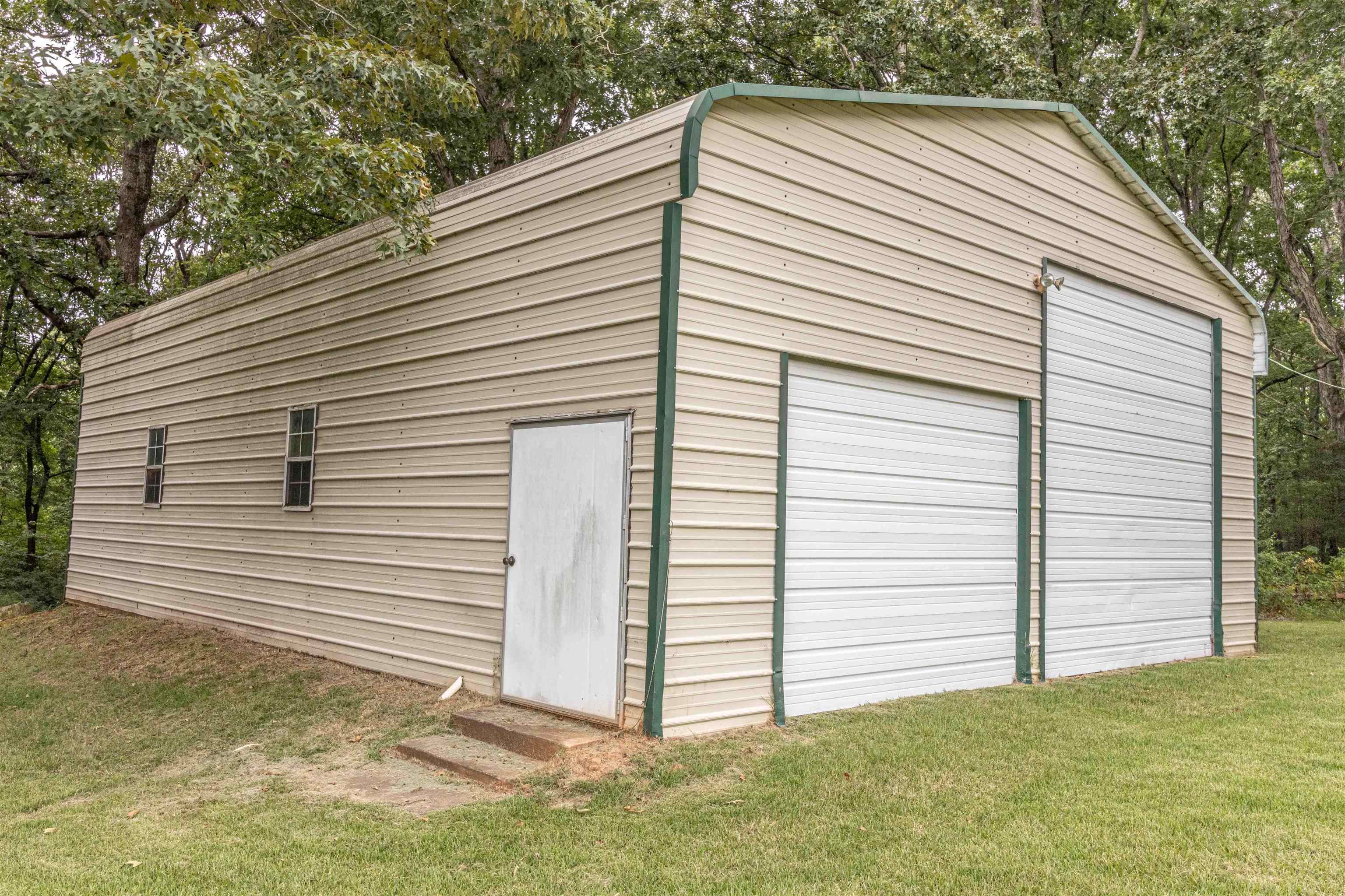 239 Old Road South, Unit 5 Selmer, TN 38375 - Photo 25 of 34 a view of a white house with a small yard