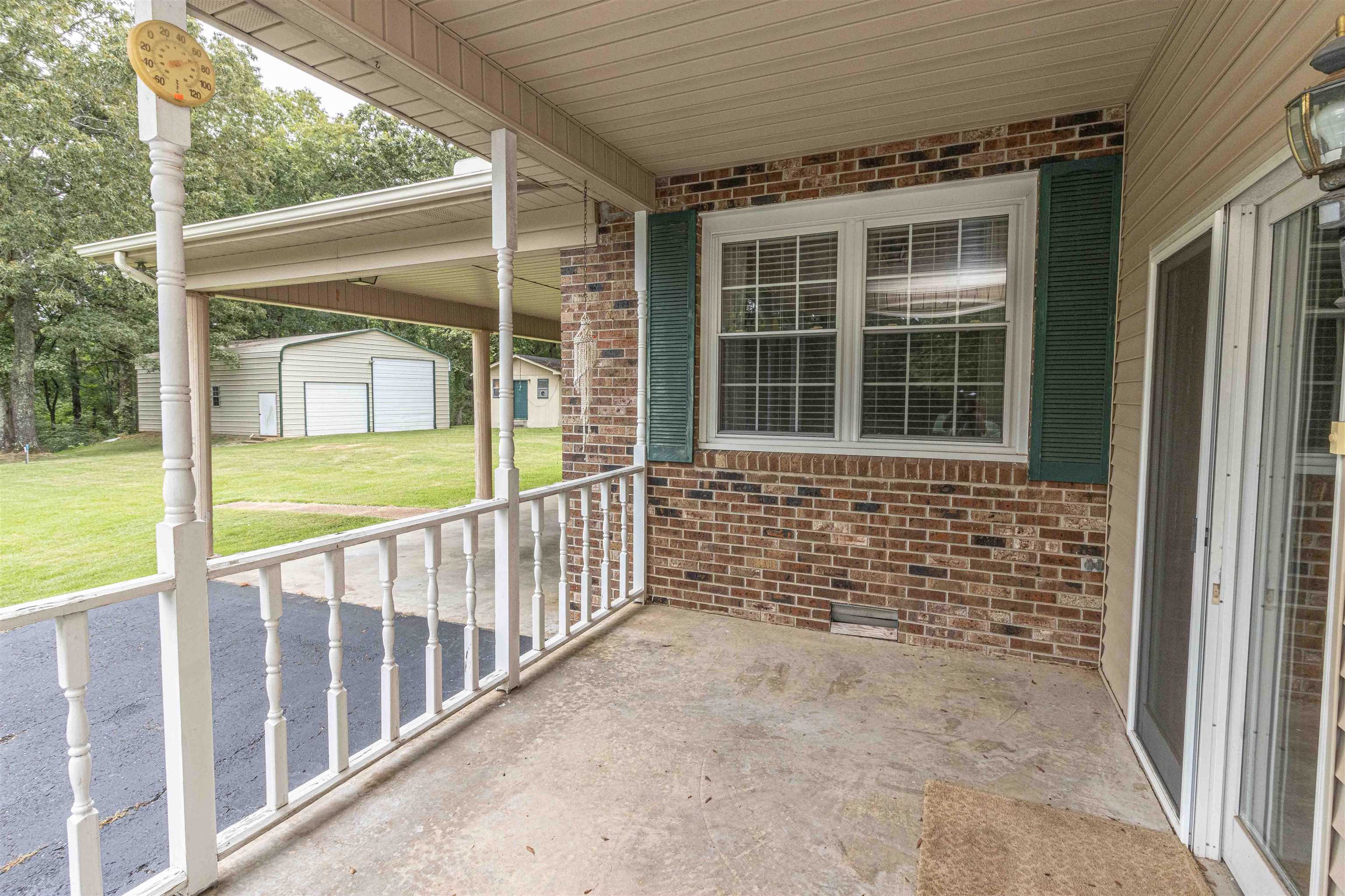 239 Old Road South, Unit 5 Selmer, TN 38375 - Photo 31 of 34 a view of a porch with a floor to ceiling window