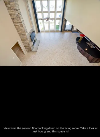 a kitchen with a black refrigerator