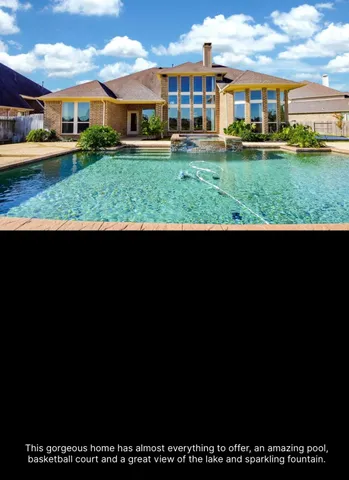 a view of house with yard and potted plants