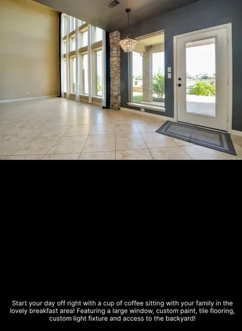 a view of kitchen with kitchen island stainless steel appliances