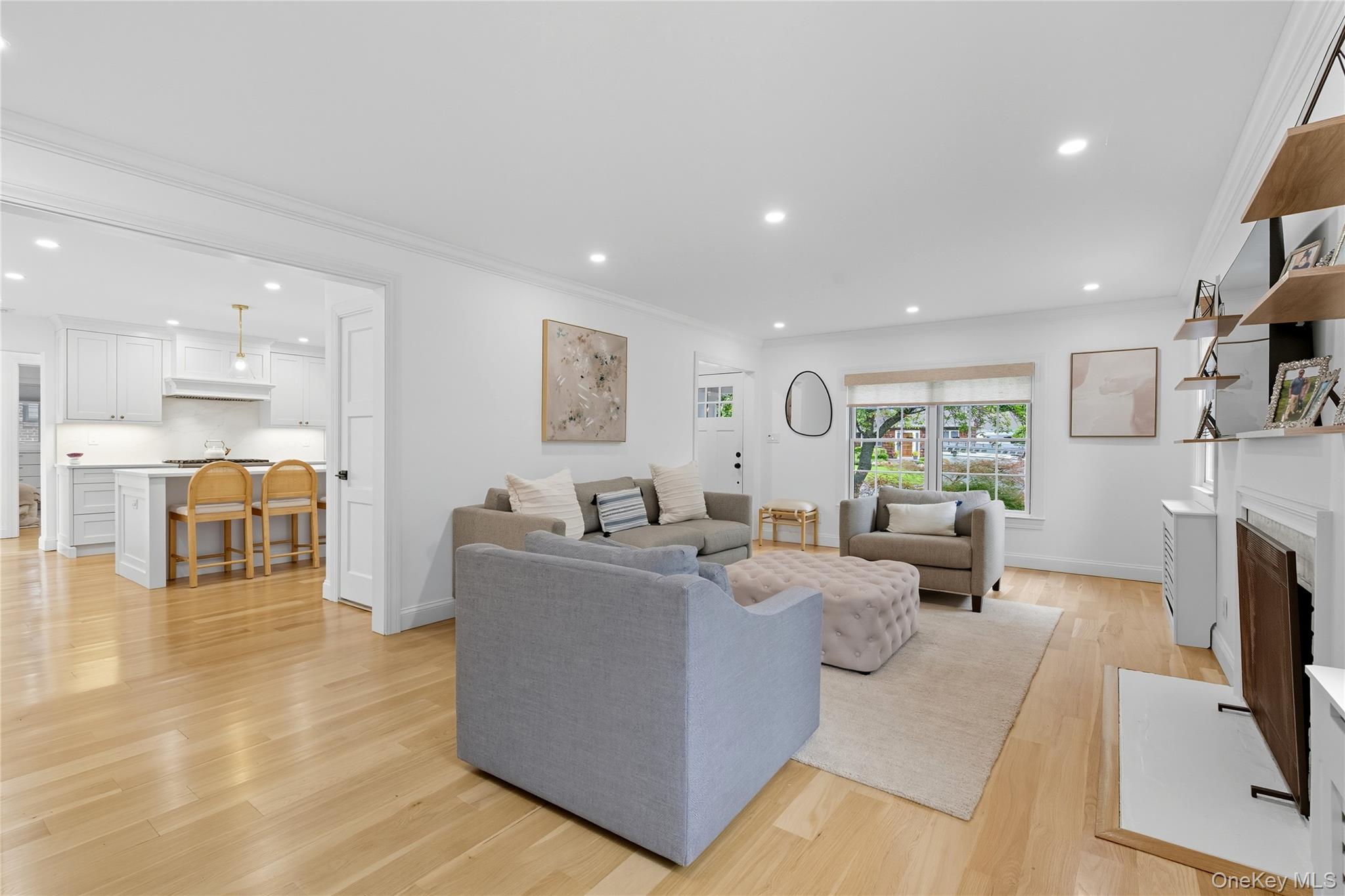 17 Entrance Road East Hills, NY 11577 - Photo 13 of 30 a living room with fireplace furniture and a kitchen view