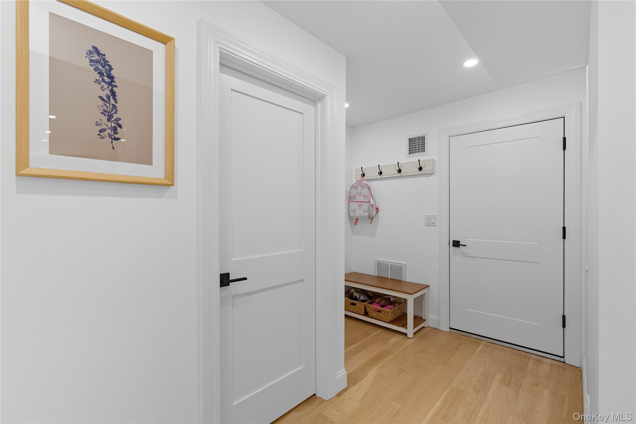 17 Entrance Road East Hills, NY 11577 - Photo 21 of 30 a view of a livingroom with a hallway and stairs
