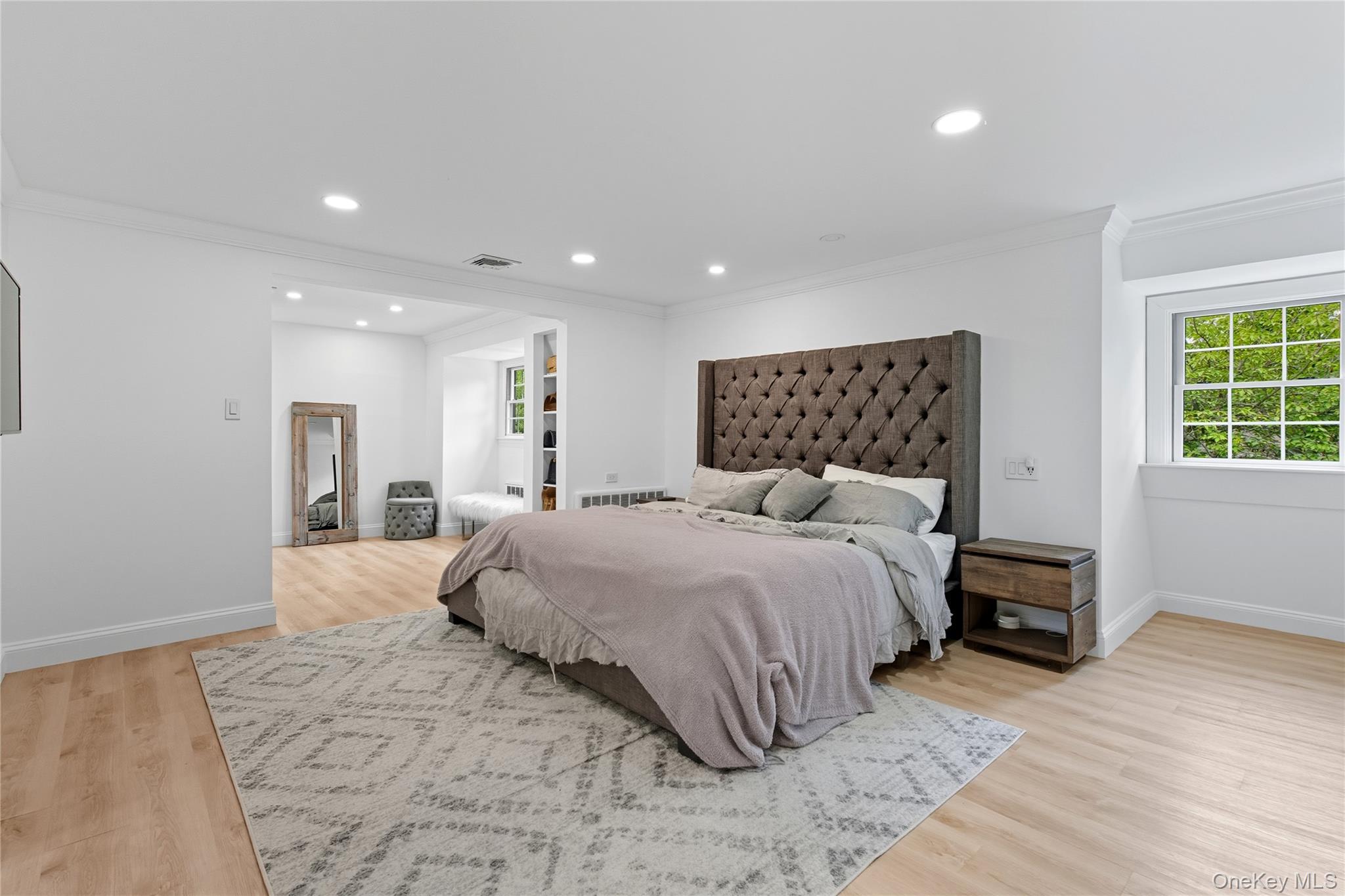 17 Entrance Road East Hills, NY 11577 - Photo 22 of 30 a bedroom with a bed and a large mirror