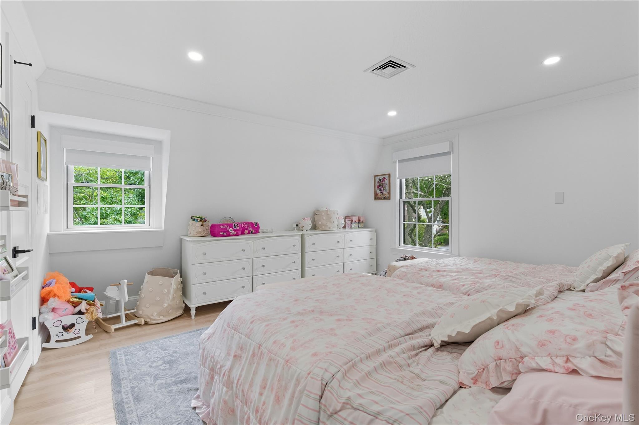17 Entrance Road East Hills, NY 11577 - Photo 25 of 30 a bedroom with a bed and a window