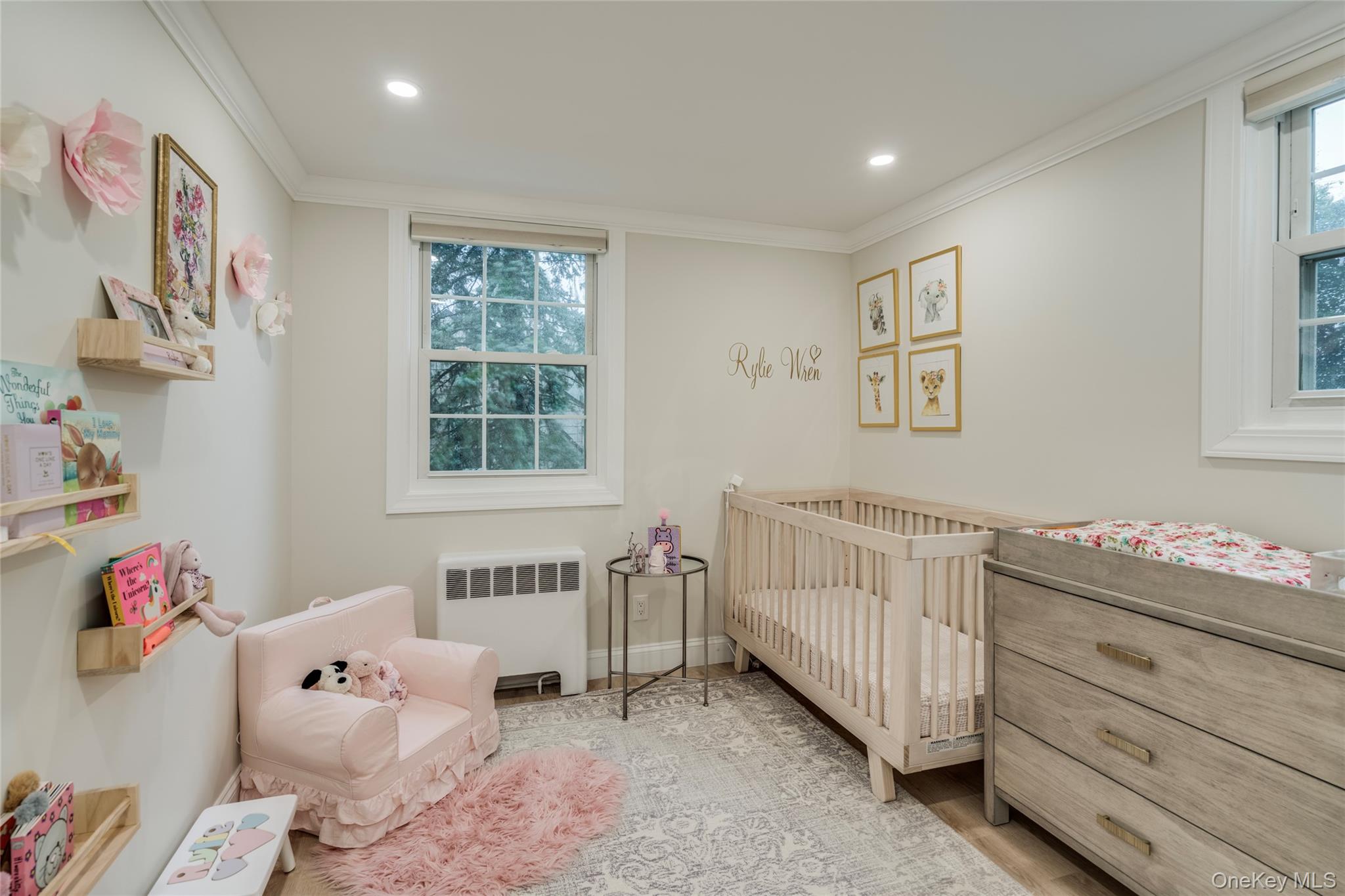 17 Entrance Road East Hills, NY 11577 - Photo 26 of 30 a bedroom with a baby bed baby crib and a window