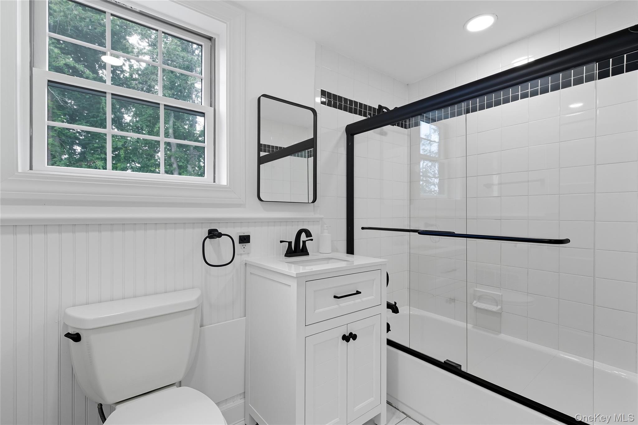 17 Entrance Road East Hills, NY 11577 - Photo 27 of 30 a bathroom with a sink a toilet and a shower
