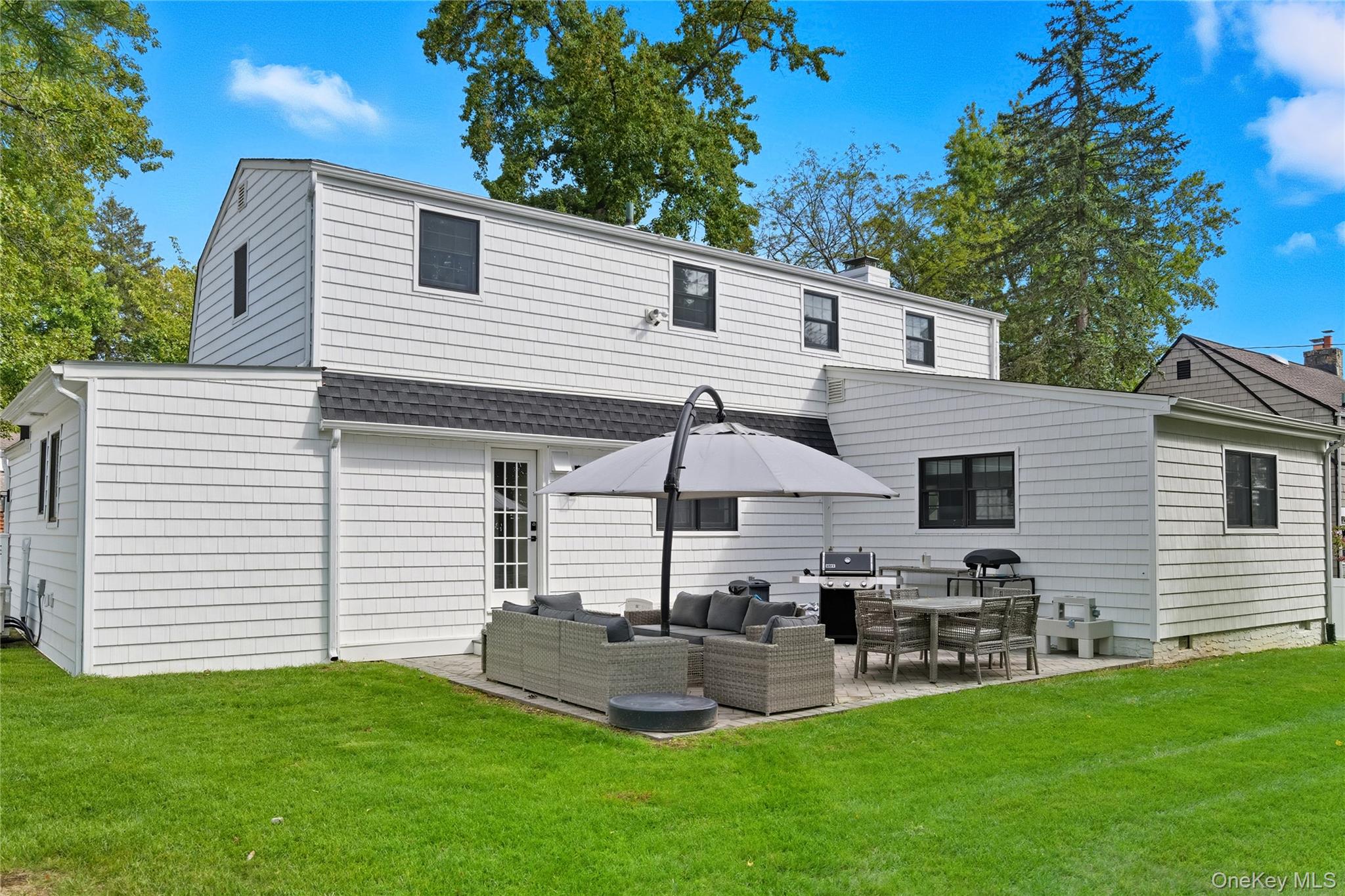 17 Entrance Road East Hills, NY 11577 - Photo 29 of 30 a view of a house with a backyard and sitting area