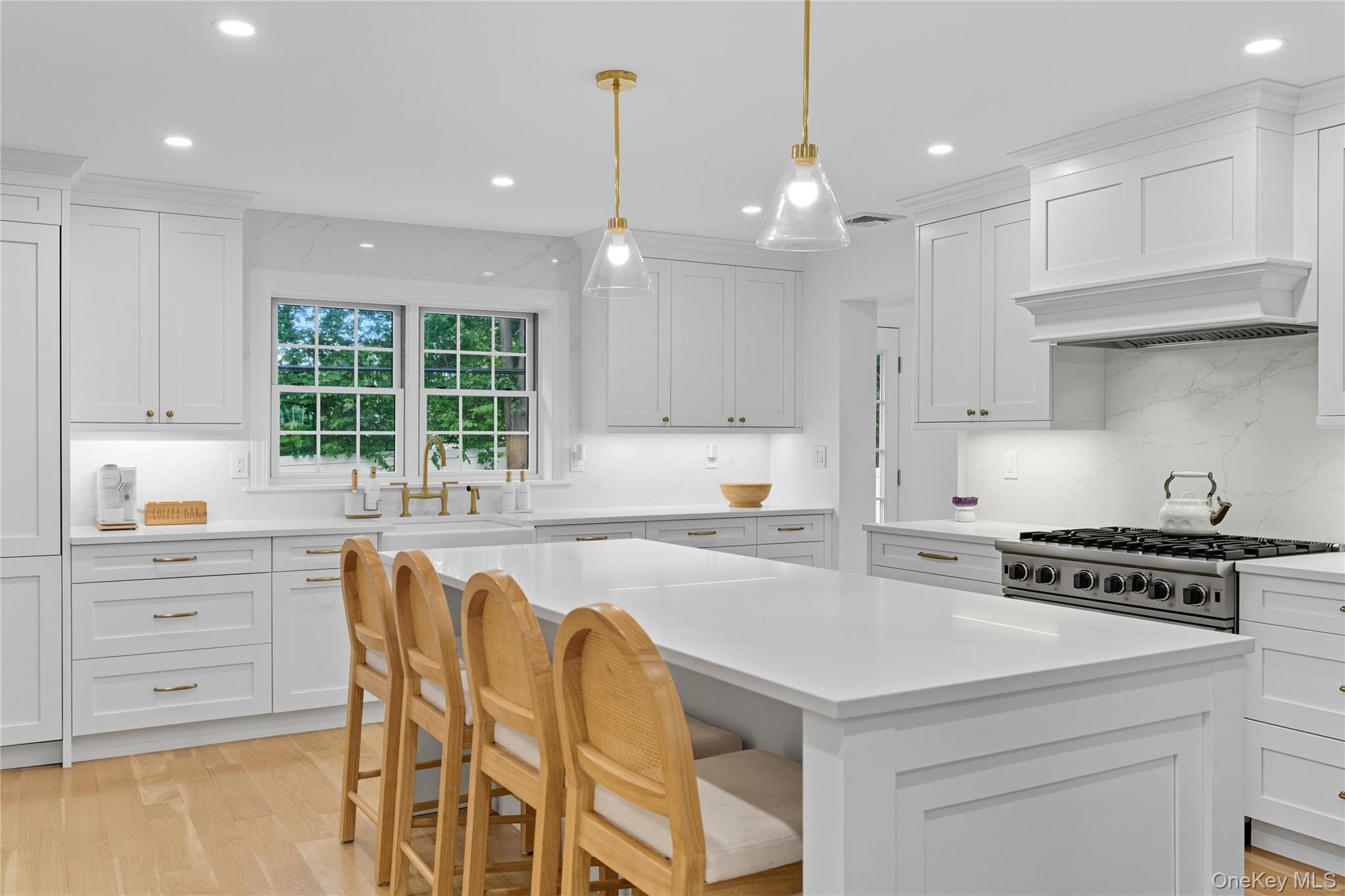 17 Entrance Road East Hills, NY 11577 - Photo 9 of 30 a kitchen that has a lot of white cabinets and stainless steel appliances