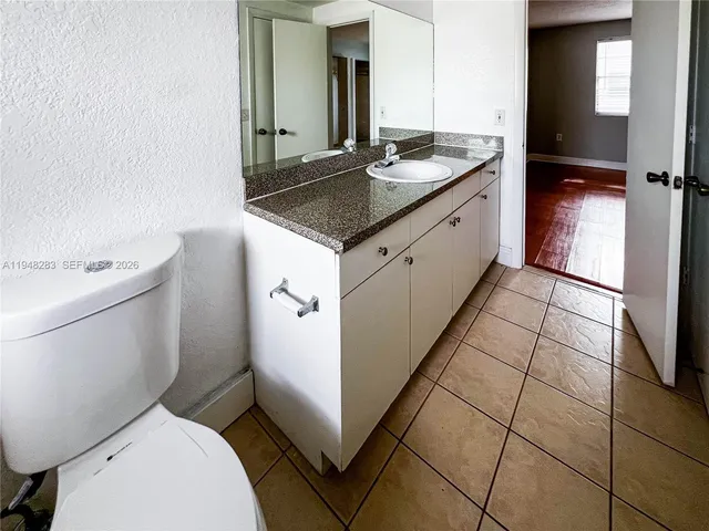 a bathroom with a sink and toilet