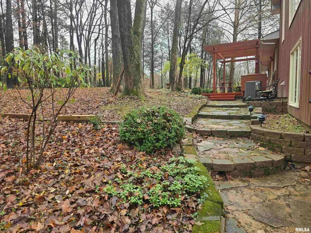 a backyard of a house with lots of green space