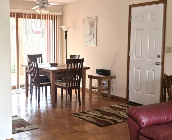 a view of a hallway with dining area