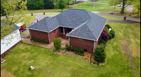 an aerial view of a house with swimming pool
