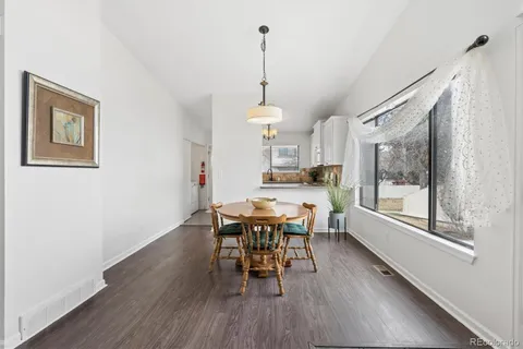 a dining room with furniture window wooden floor