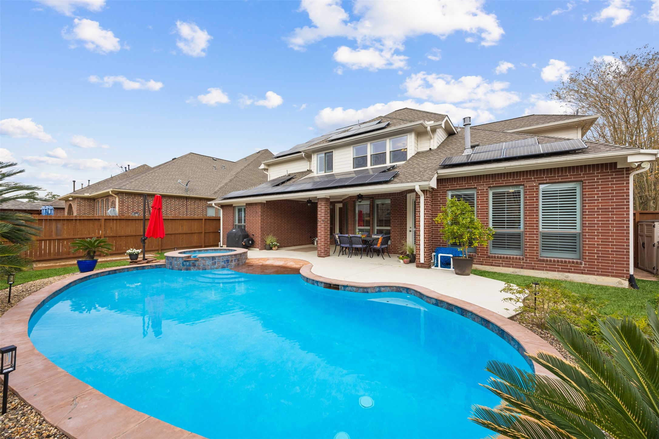 Resort-style living in a gated luxury community. Private pool, covered patio, and paid-off solar—this 5 bedroom -Spring home in Klein ISD is worth the wait!