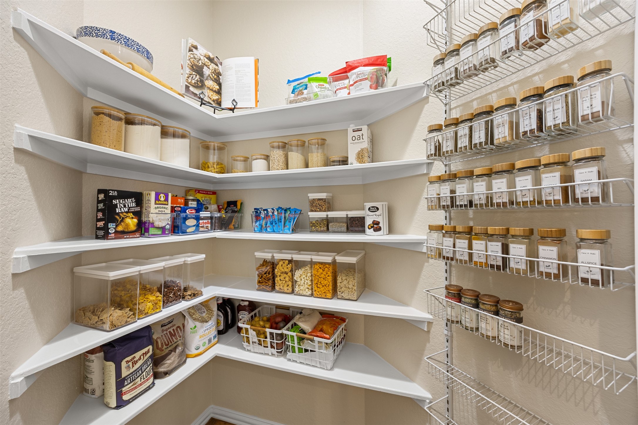 2603 Hendricks Lakes Drive Spring, TX 77388 - Photo 13 of 50 Highly functional walk-in pantry with wraparound shelving, organized spice racks, and abundant storage for dry goods and kitchen essentials.