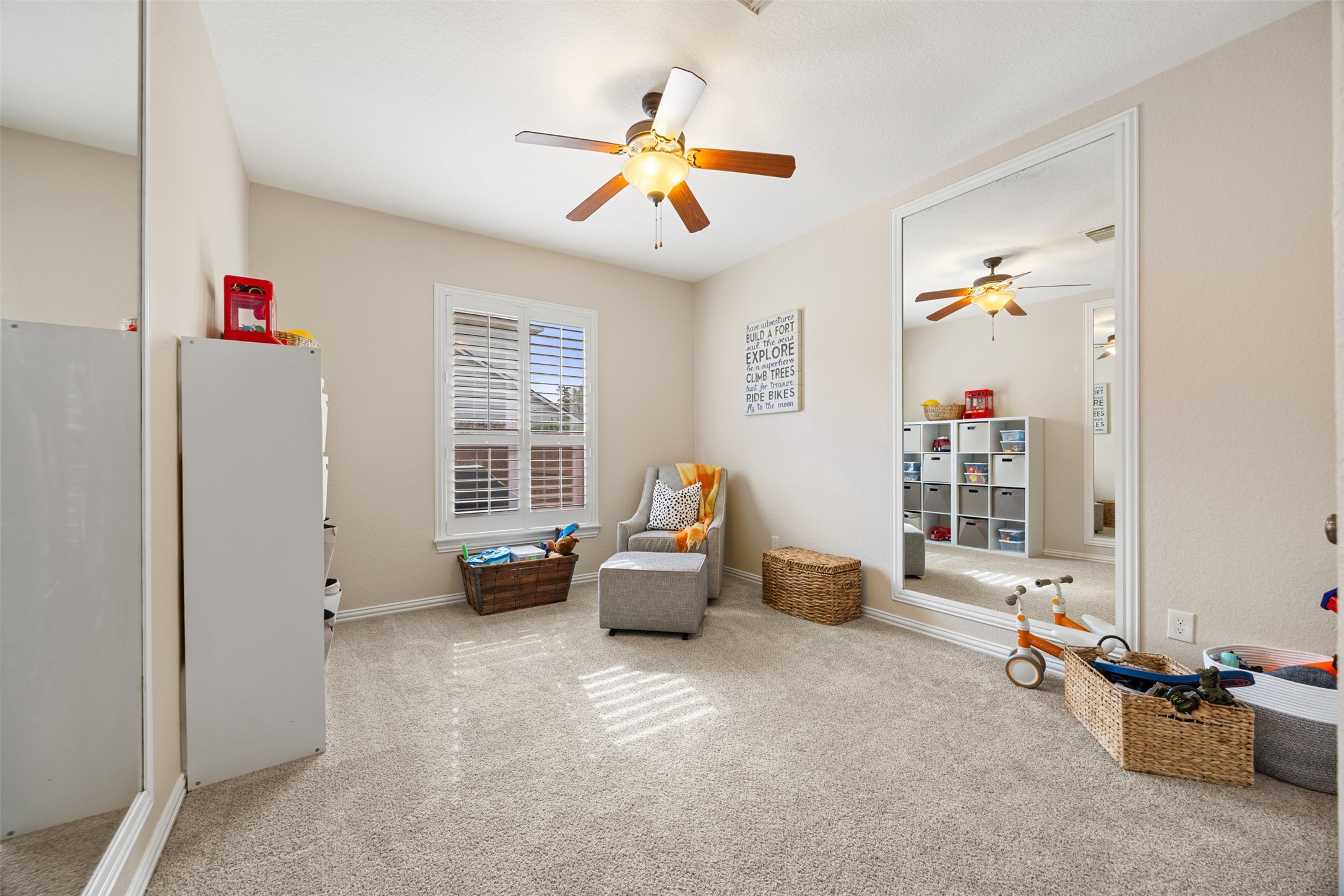 2603 Hendricks Lakes Drive Spring, TX 77388 - Photo 16 of 50 Versatile downstairs secondary bedroom currently used as a playroom, conveniently located off the kitchen with pool views. Adjacent storage closet is plumbed and offers future potential for a full bath conversion—ideal for creating a private guest suite.