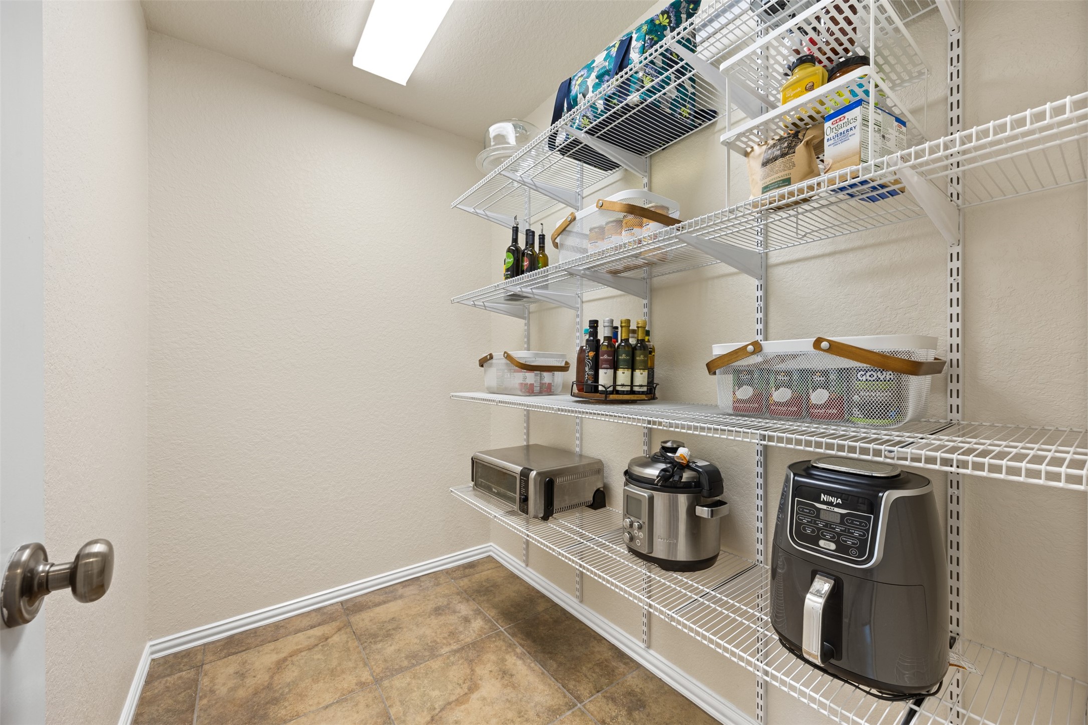 2603 Hendricks Lakes Drive Spring, TX 77388 - Photo 17 of 50 Oversized storage closet near the kitchen and downstairs secondary bedroom with potential for future bathroom conversion — plumbing access nearby makes it an excellent opportunity to create a private guest suite or mother-in-law suite.
