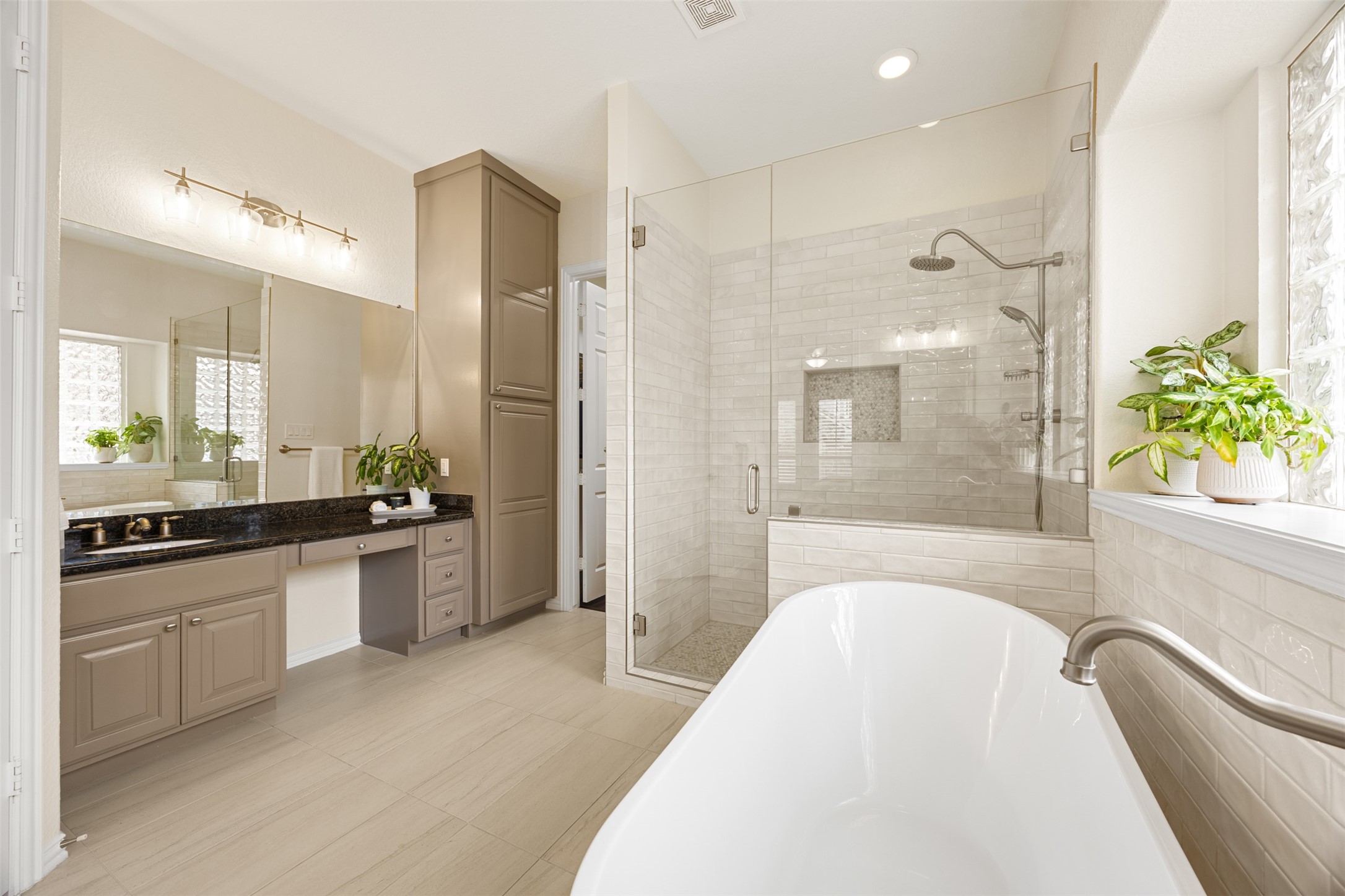 2603 Hendricks Lakes Drive Spring, TX 77388 - Photo 21 of 50 Beautifully updated primary bath with freestanding tub, large glass shower, dual sinks, and extensive cabinet storage. Bright, airy, and thoughtfully designed.