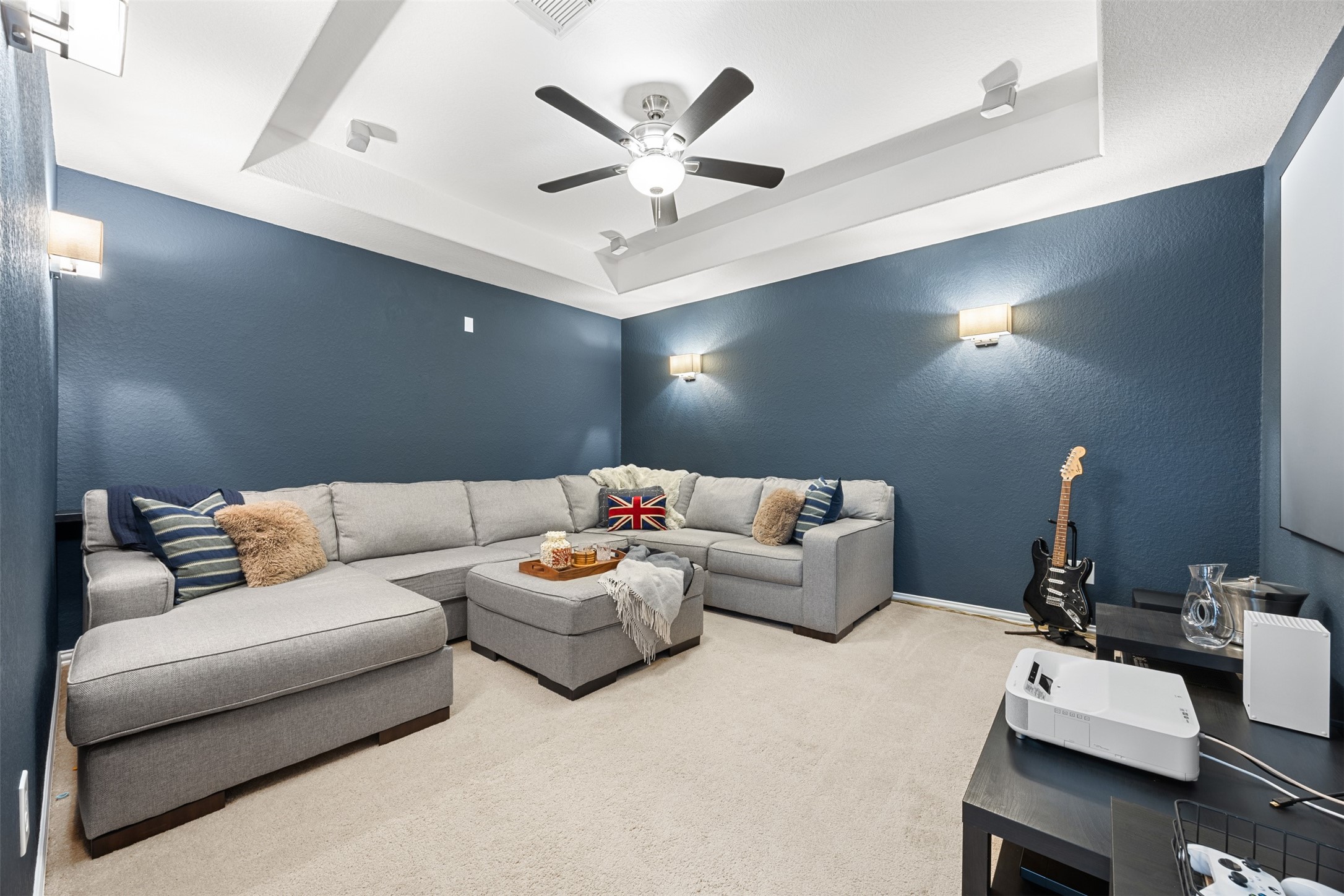 2603 Hendricks Lakes Drive Spring, TX 77388 - Photo 28 of 50 Spacious upstairs media room featuring tray ceilings, neutral carpeting, and versatile layout—ideal for movie nights, gaming, or a secondary living area. A flexible space that adds even more functionality to this 5-bedroom home.