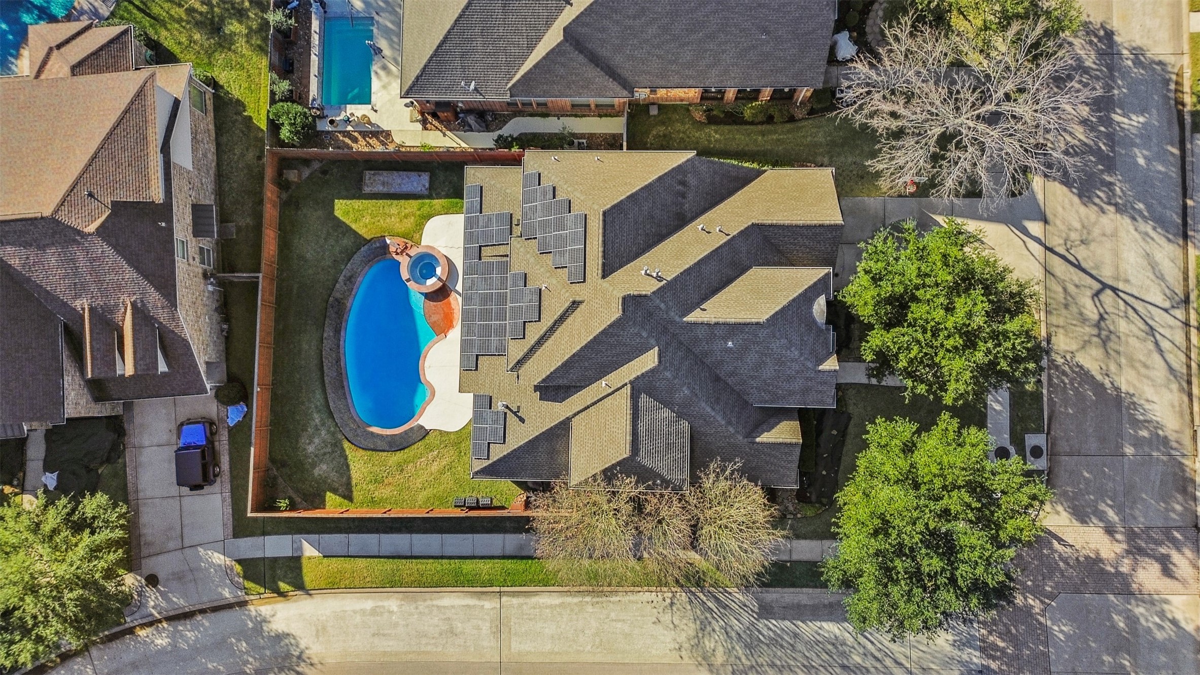 2603 Hendricks Lakes Drive Spring, TX 77388 - Photo 47 of 50 Impressive aerial perspective showcasing the private backyard pool and spa, covered patio, and fully paid-off solar panel system. Situated on a spacious corner lot with generous yard space and added privacy.