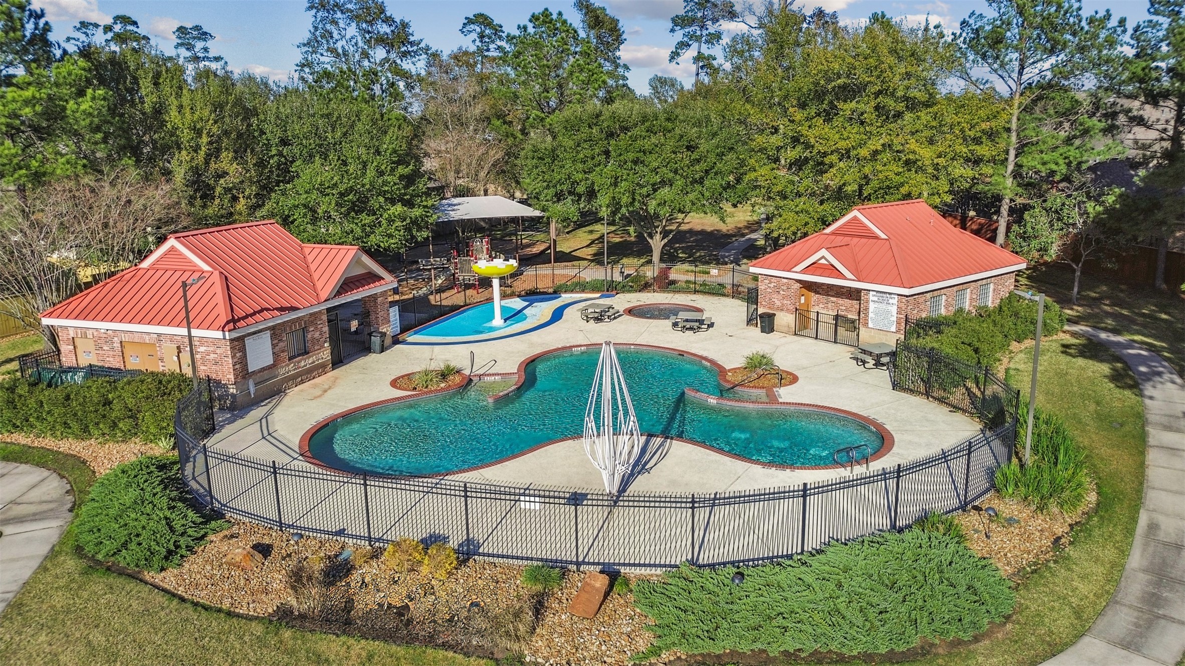 2603 Hendricks Lakes Drive Spring, TX 77388 - Photo 49 of 50 Enjoy access to a beautifully maintained community pool and splash pad, offering resort-style amenities just moments from your front door.