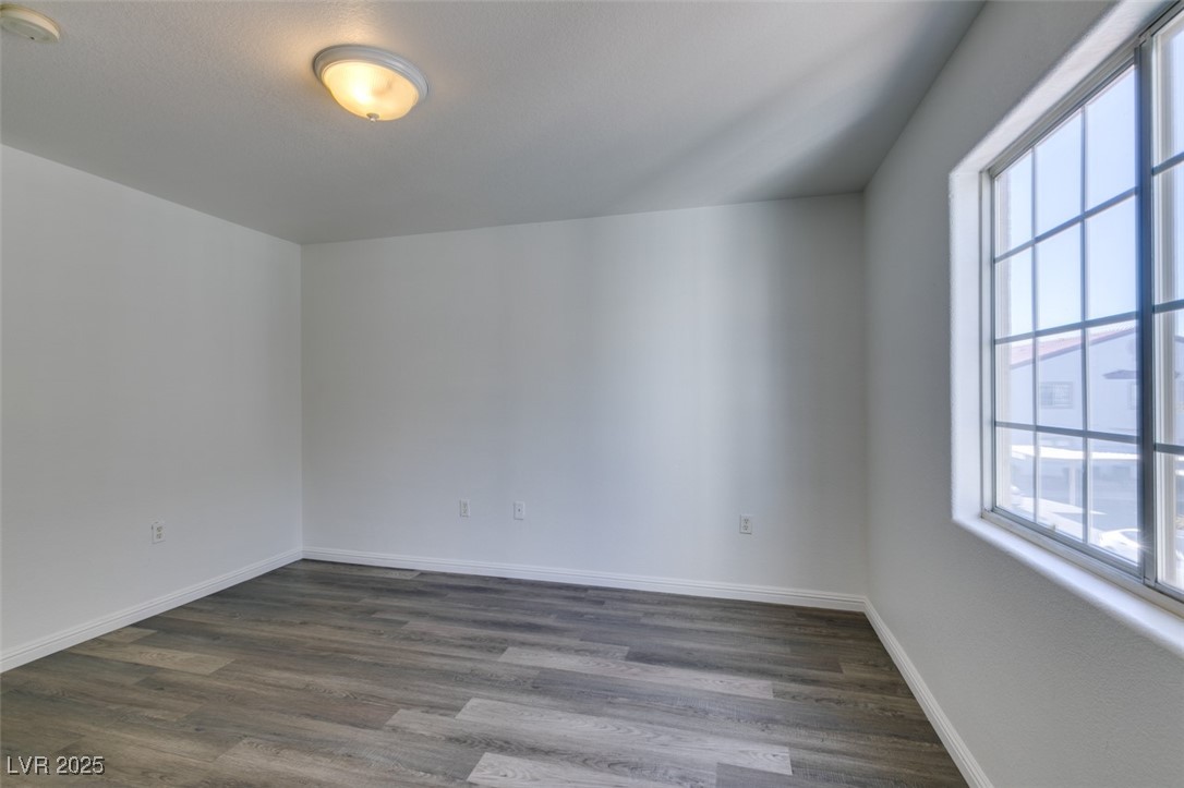 3318 North Decatur Boulevard, Unit 2138 Las Vegas, NV 89130 - Photo 32 of 40 Bonus room with dark wood finished floors and baseboards