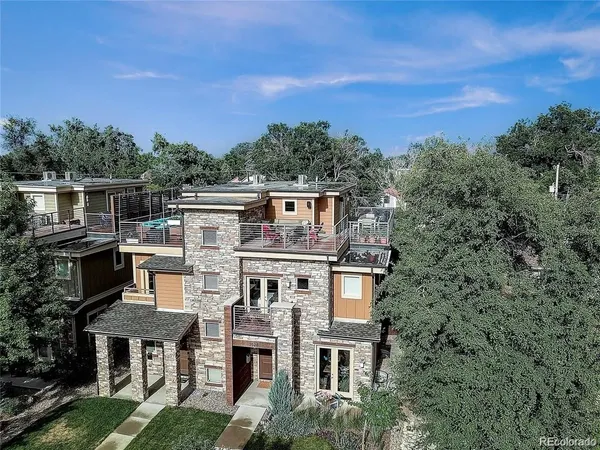 an aerial view of a house with a yard