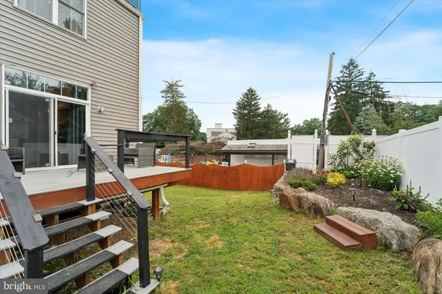 a view of a backyard with sitting area