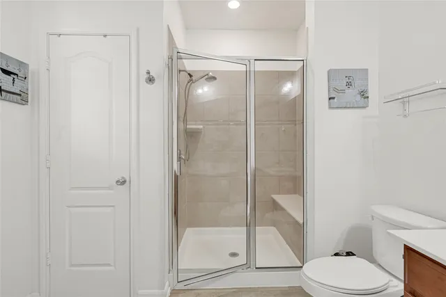 a bathroom with a shower and a toilet