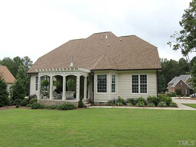 3616 Griffice Mill Road Raleigh, NC 27610 - Photo 23 of 25 a front view of a house with a garden