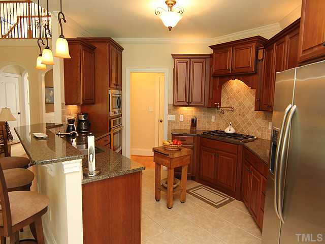 3616 Griffice Mill Road Raleigh, NC 27610 - Photo 9 of 25 a room with granite countertop furniture a sink and a window