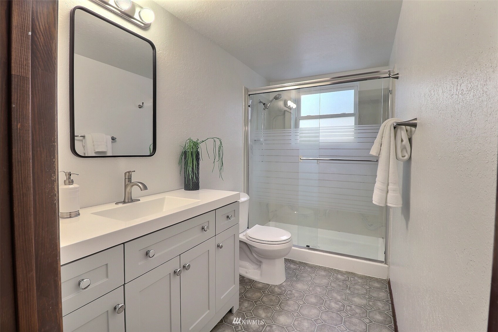 22105 2nd Place West Bothell, WA 98021 - Photo 26 of 37 a bathroom with a granite countertop sink toilet and shower