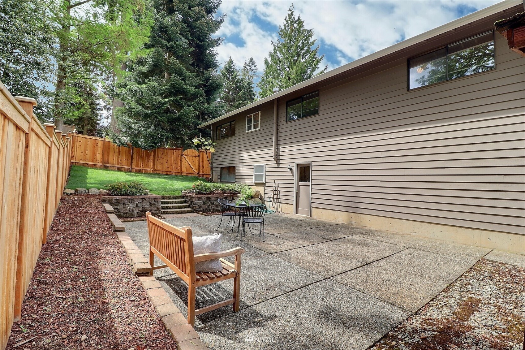 22105 2nd Place West Bothell, WA 98021 - Photo 31 of 37 a view of backyard with outdoor seating and plants