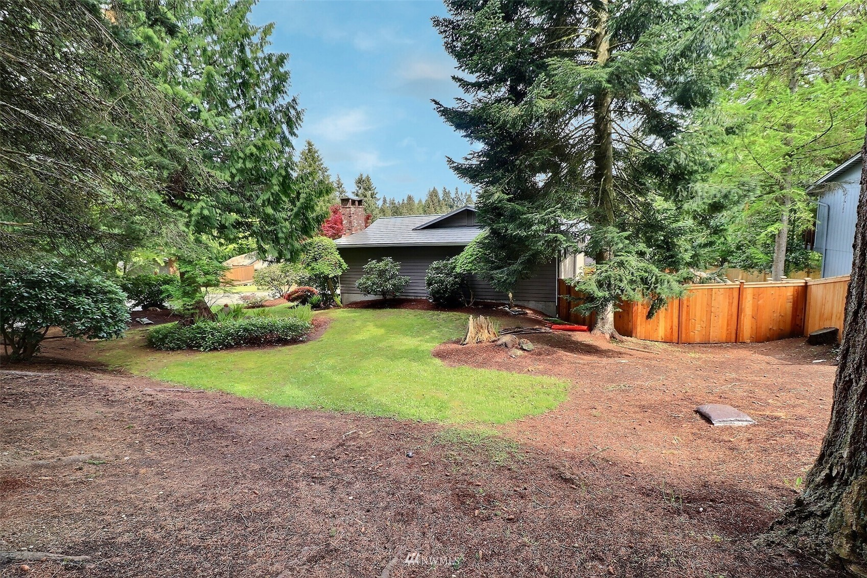 22105 2nd Place West Bothell, WA 98021 - Photo 35 of 37 a view of a backyard with a fountain