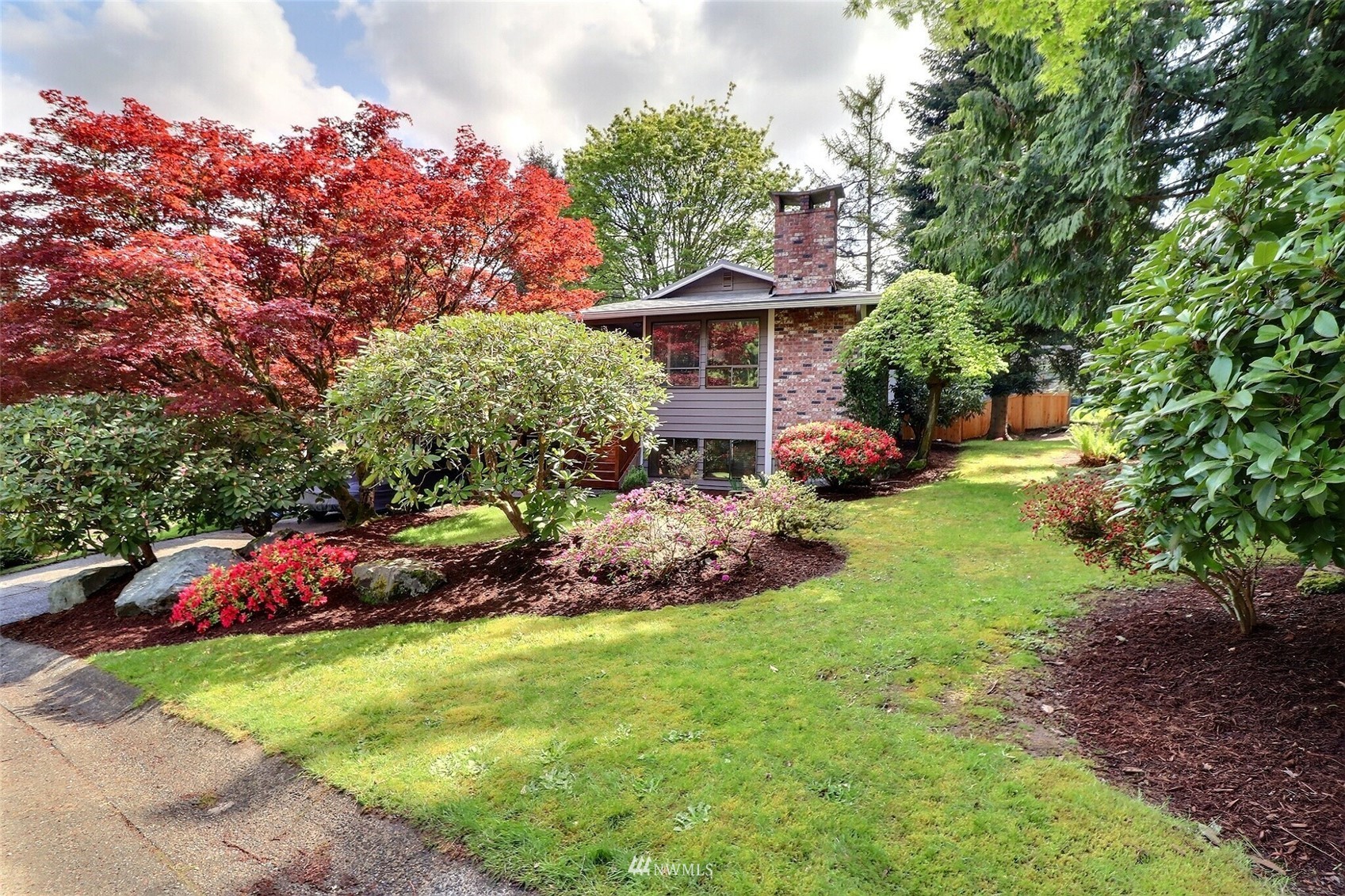 22105 2nd Place West Bothell, WA 98021 - Photo 4 of 37 a front view of a house with garden