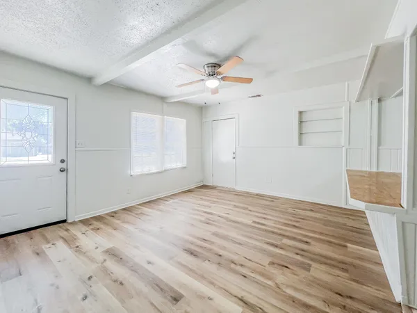 a kitchen with a stove top oven sink and cabinets