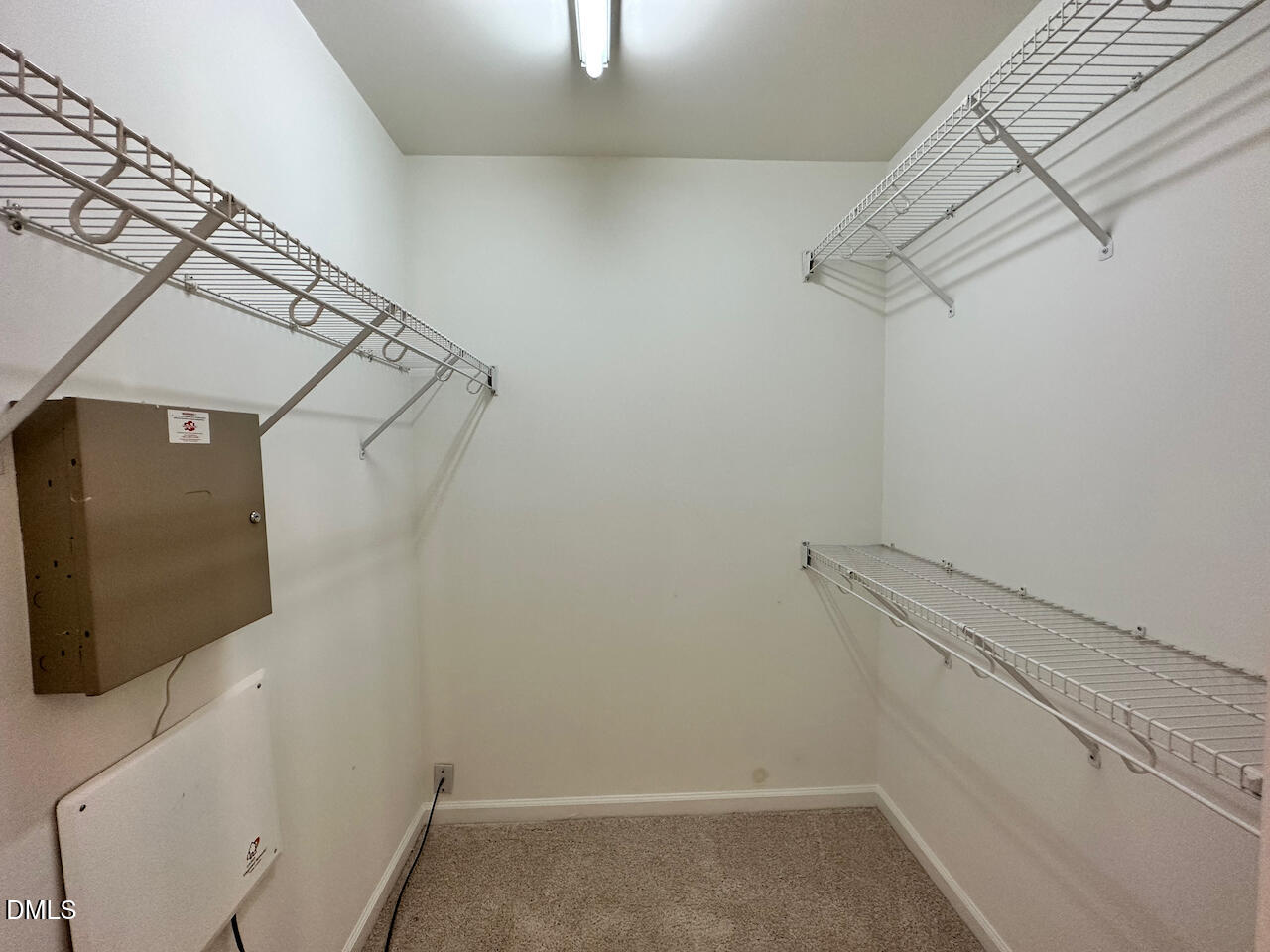 5105 Obion Court Raleigh, NC 27616 - Photo 15 of 22 a view of a room with racks on the wall