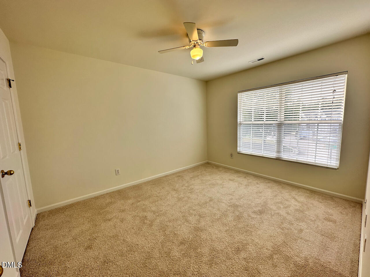 5105 Obion Court Raleigh, NC 27616 - Photo 16 of 22 an empty room with windows and ceiling fan