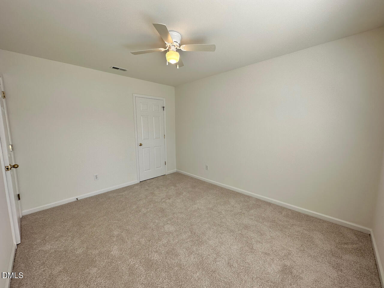 5105 Obion Court Raleigh, NC 27616 - Photo 17 of 22 an empty room with a chandelier fan