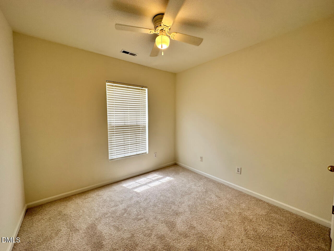 5105 Obion Court Raleigh, NC 27616 - Photo 18 of 22 a view of an empty room with a window
