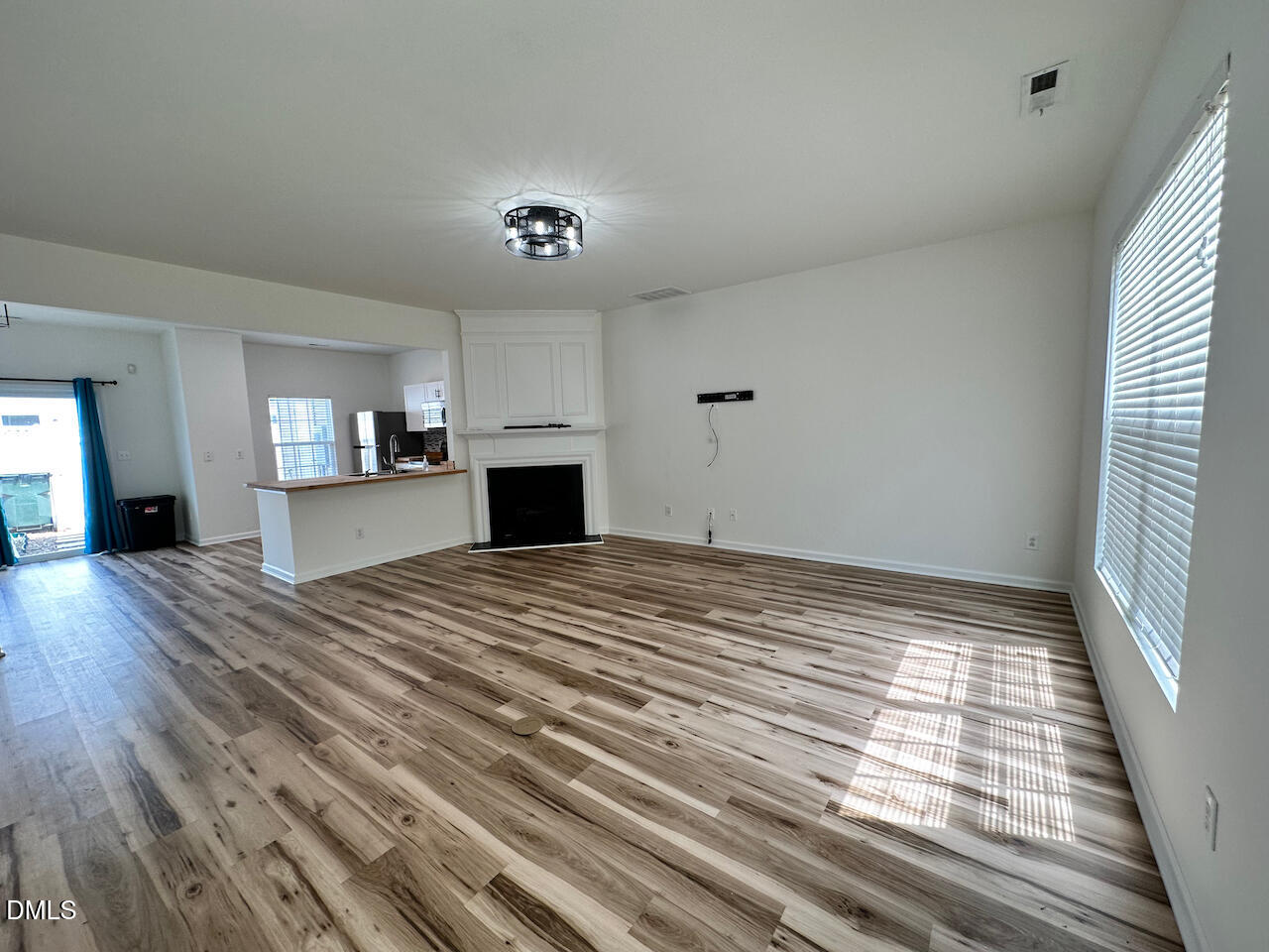 5105 Obion Court Raleigh, NC 27616 - Photo 3 of 22 a big room with wooden floor and windows