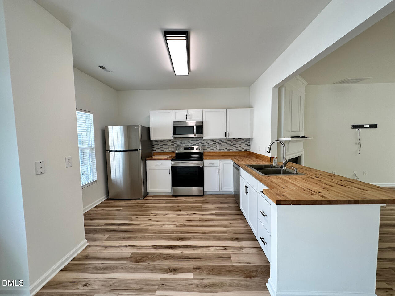 5105 Obion Court Raleigh, NC 27616 - Photo 6 of 22 a large kitchen with a stove and a refrigerator