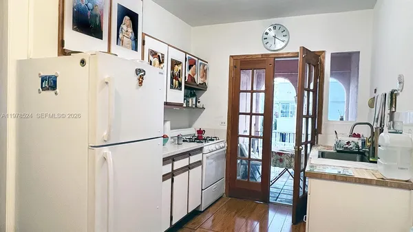 a kitchen with stainless steel appliances a refrigerator and a stove