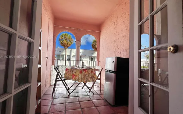 a kitchen with stainless steel appliances granite countertop a refrigerator and a window