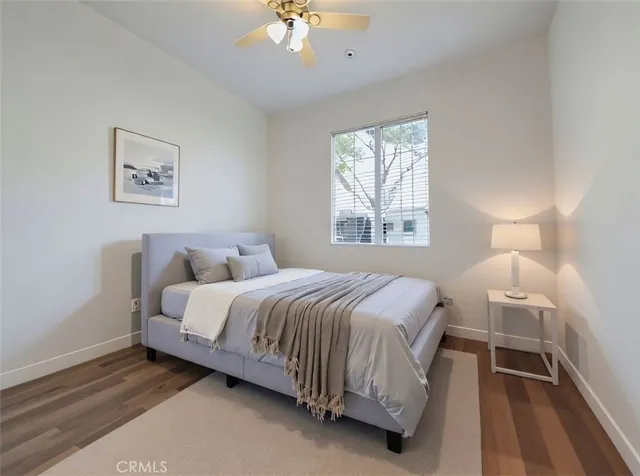 a bedroom with a bed and a lamp