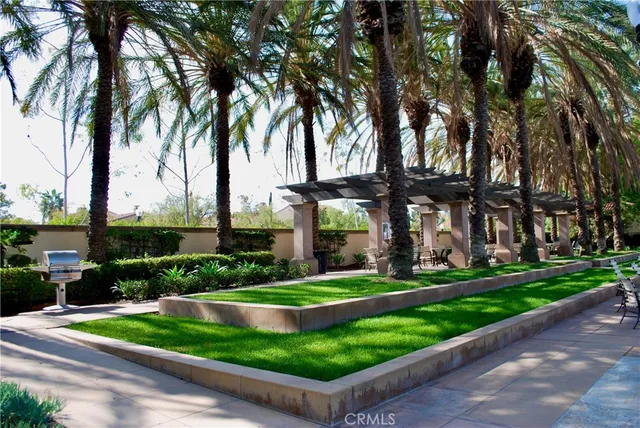 a view of yard with swimming pool and trees