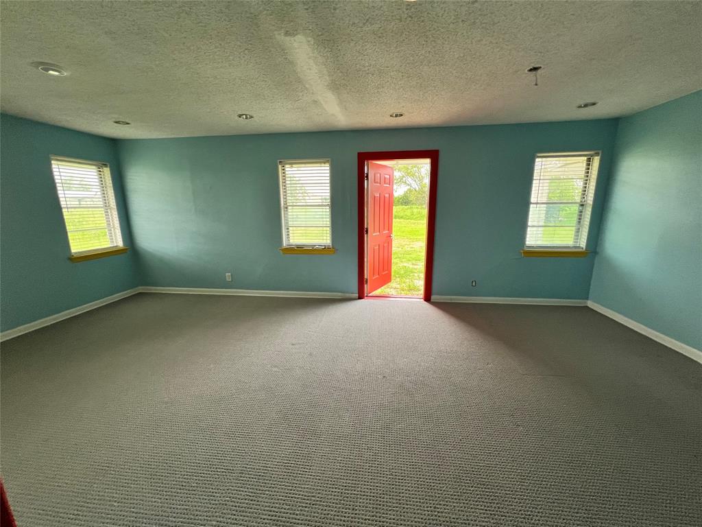 5811 Horizon Road Rockwall, TX 75032 - Photo 18 of 30 a view of an empty room with window